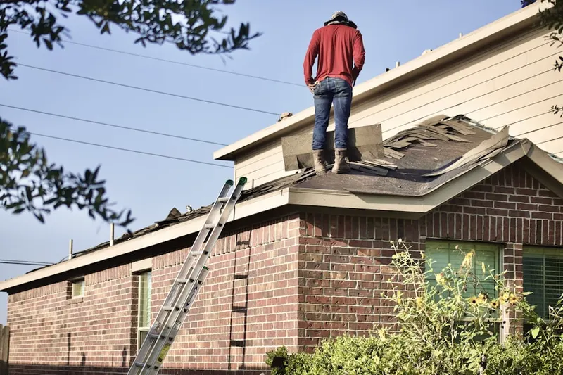 Professional roofer working on a residential roof in Marsh Creek